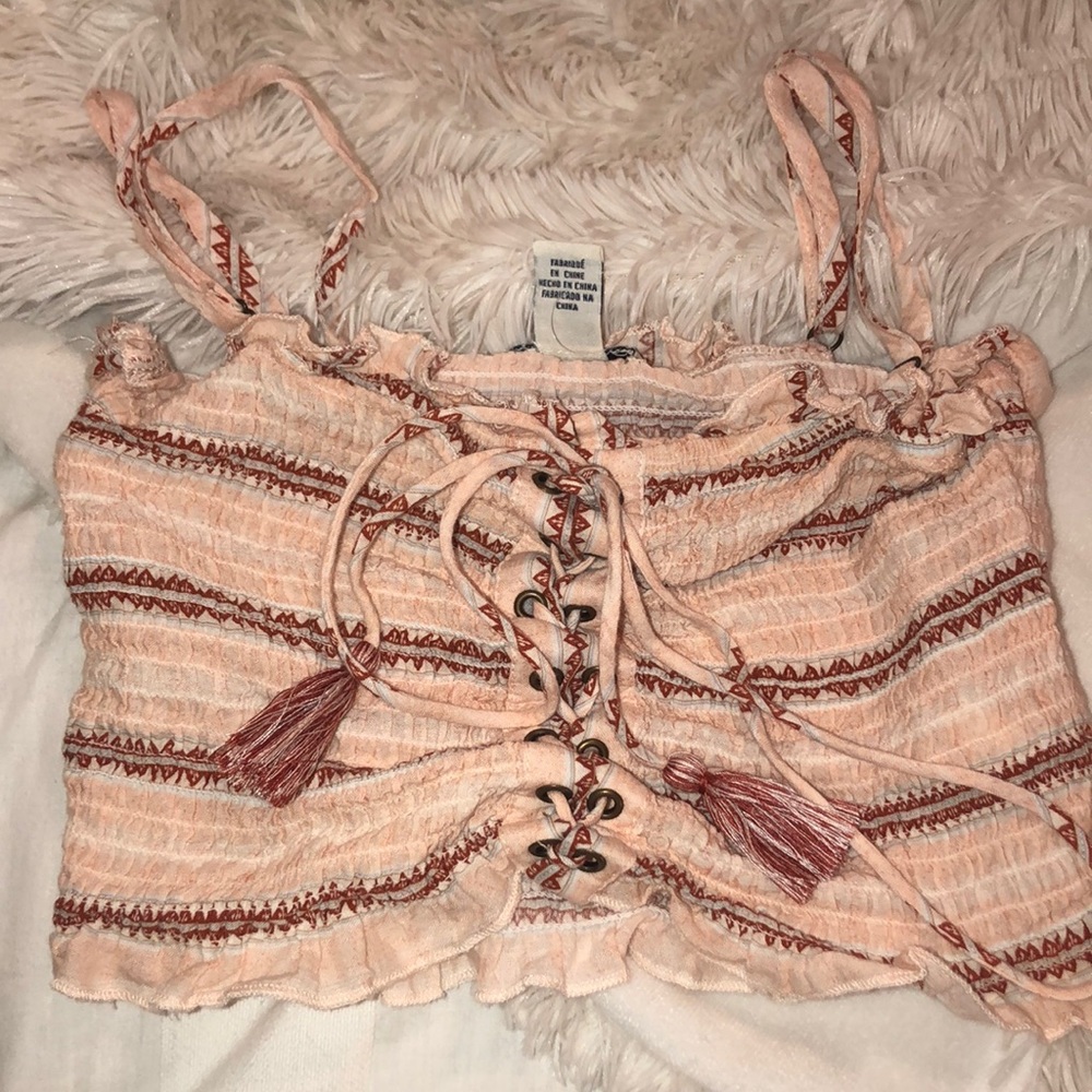 A cropped lace up shirt